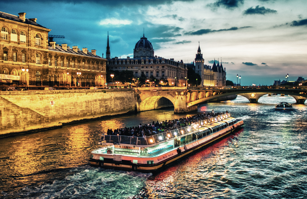 Bateau Mouche Cruising on Seine River at Sunset, Paris